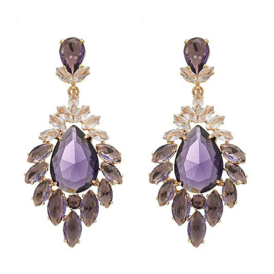 Pair of purple teardrop earrings with gold accents on a white background