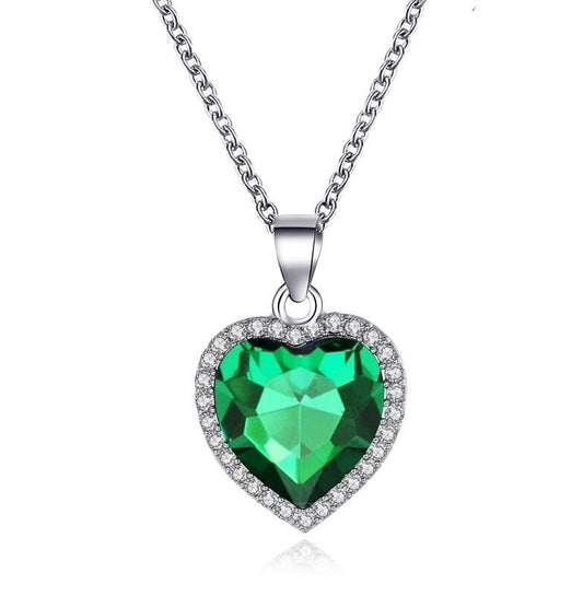 a green and silver heart shaped pendant necklace
