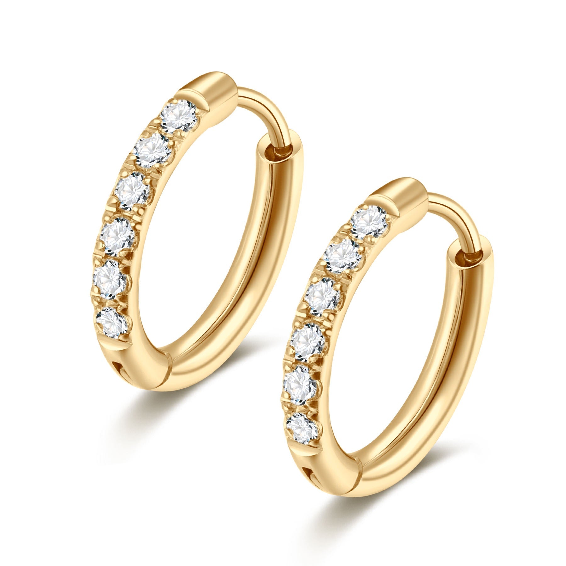 Gold hoop earrings with embedded diamonds on a white background