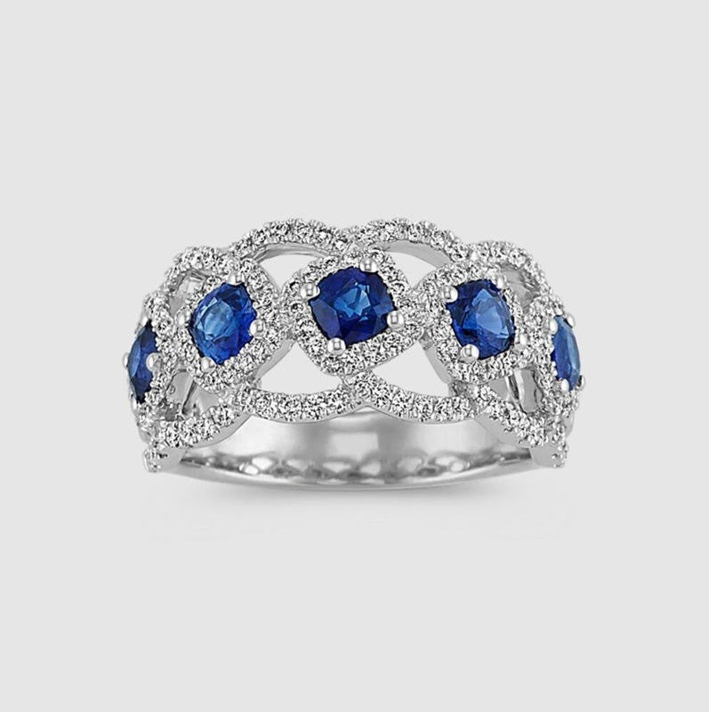 Silver ring with blue gemstones on a soft background