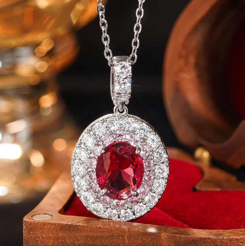 silver and red gemstone necklace