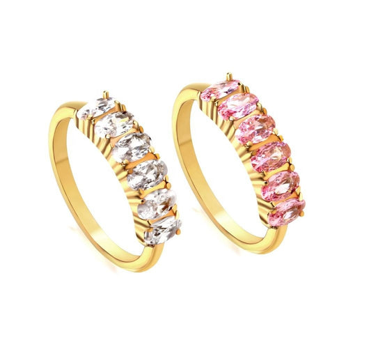 Two gold hoop earrings with clear and pink gemstones on a white background
