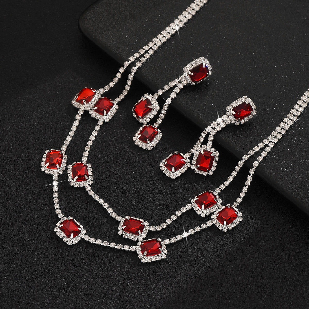 Necklace with red gemstones on a black background