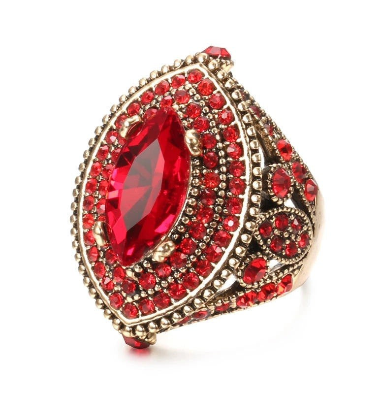 red and gold ring on a white background