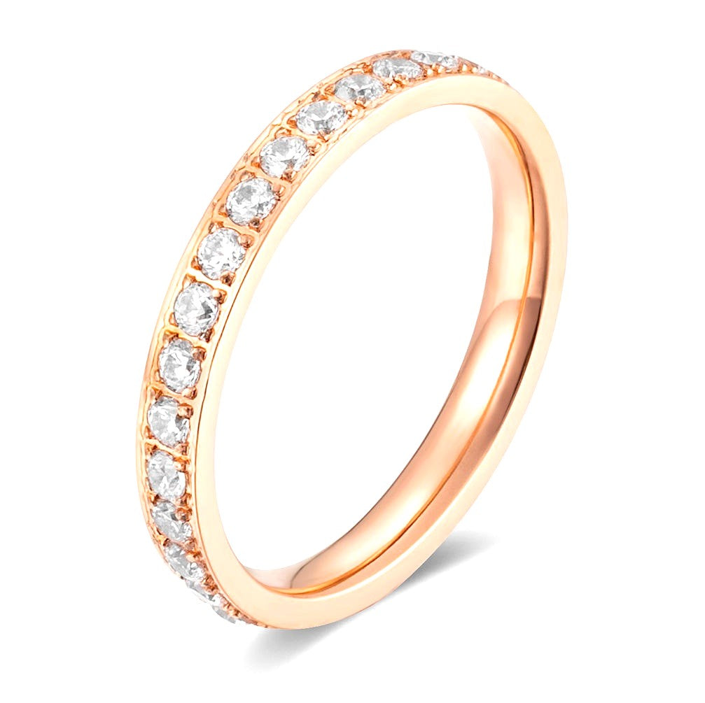 Rose gold ring with diamonds on a white background